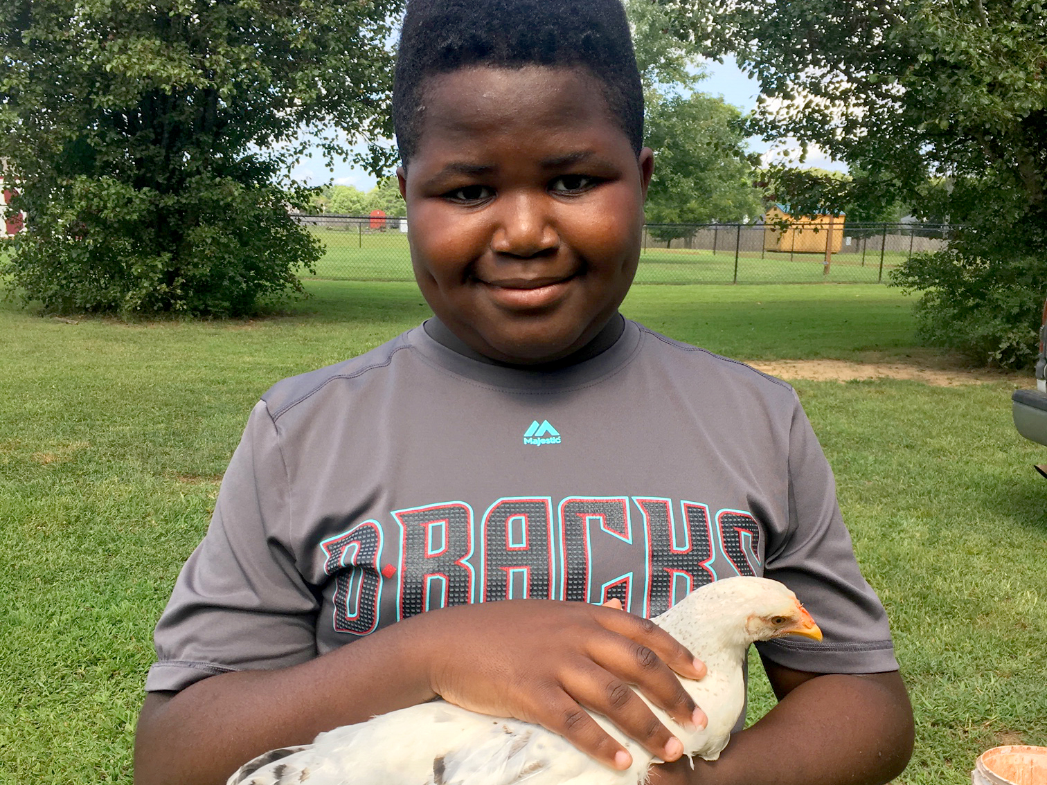 youth holding a duck