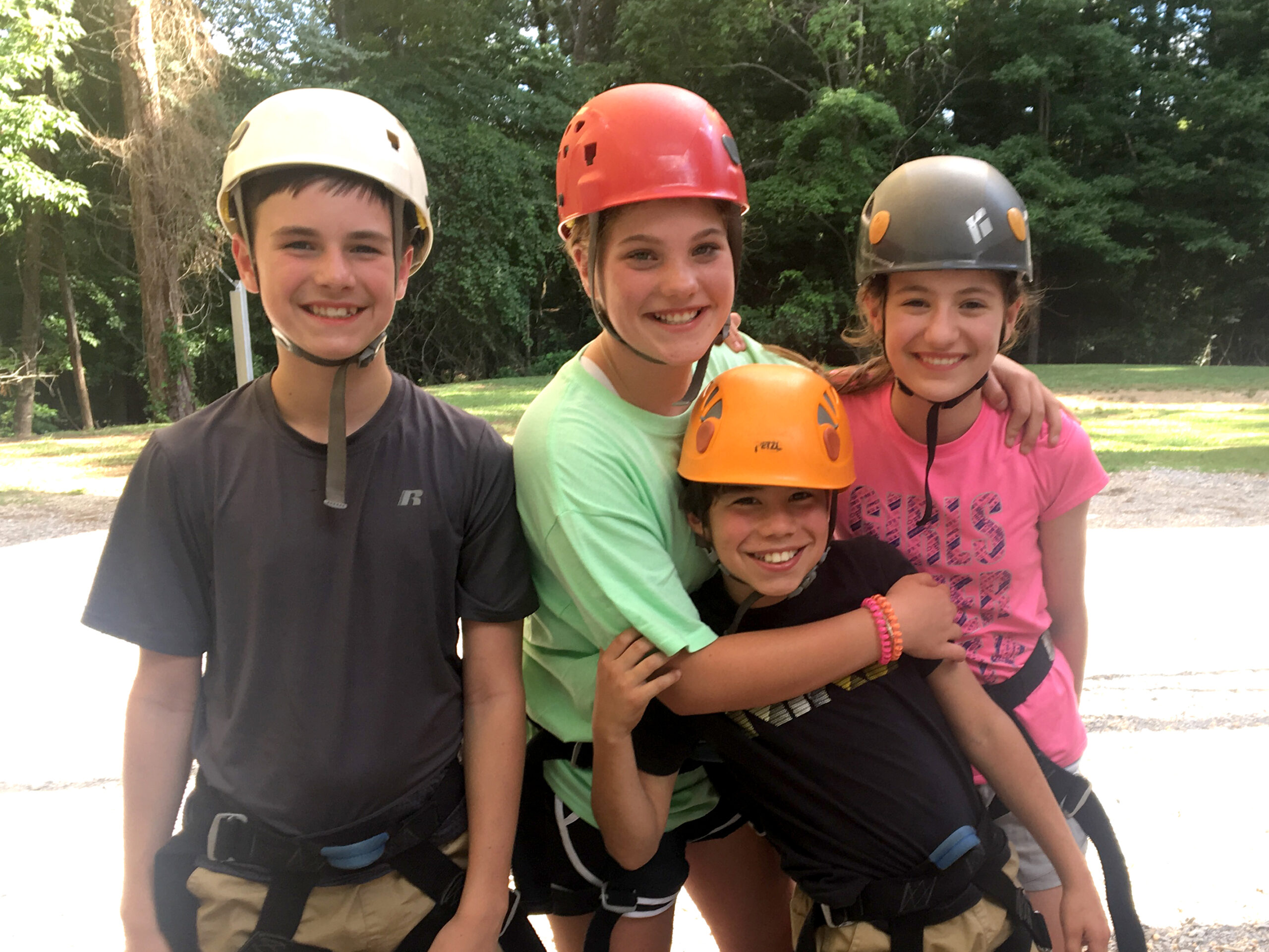 friends at camp in safety helmets